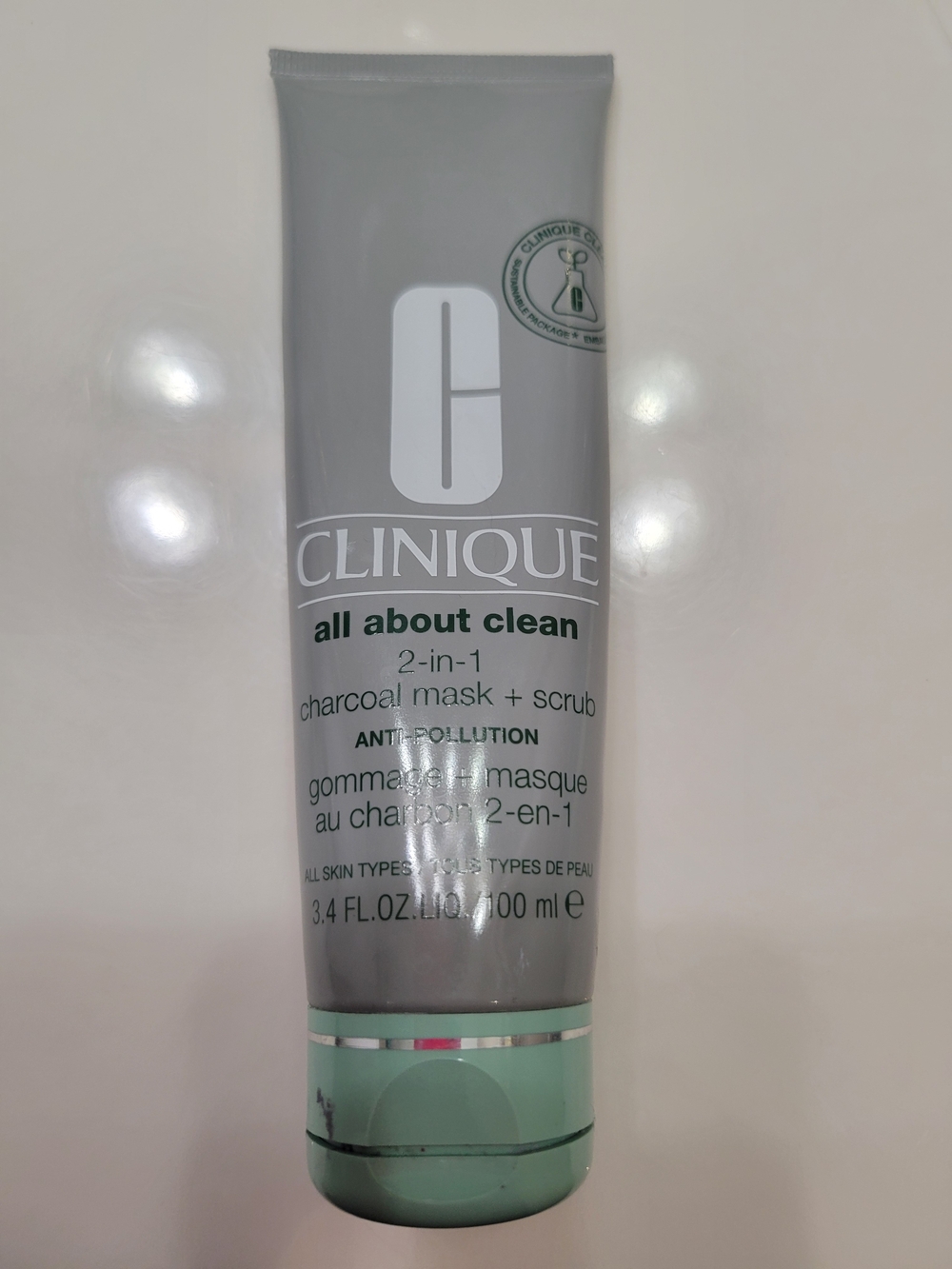 Clinique All About Clean 2-in-1 Charcoal Mask + Scrub - Gray and Mint. Half Full
